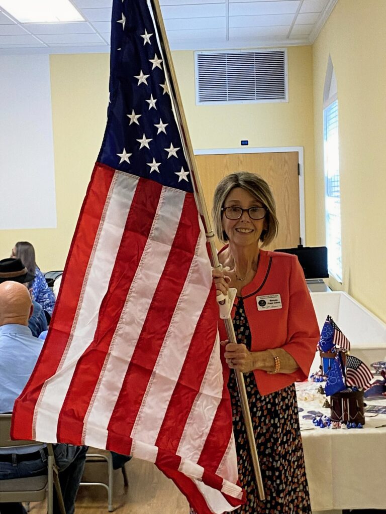 Brenda Odom holding U.S. flag